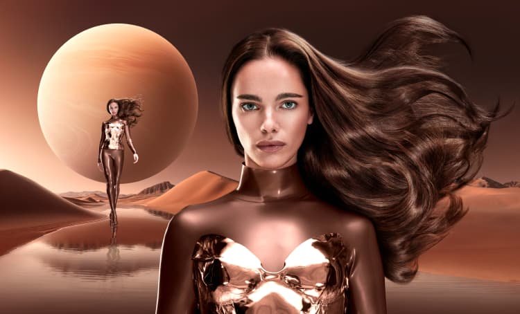Woman standing against a desert-like intergalactic background, showcasing her vibrant Titan Bronze hair color and bold identity